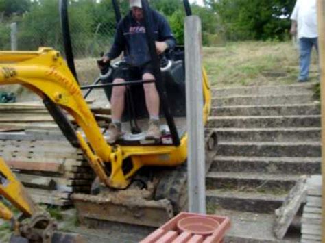 how to get a mini digger up steps|how to drive mini excavator.